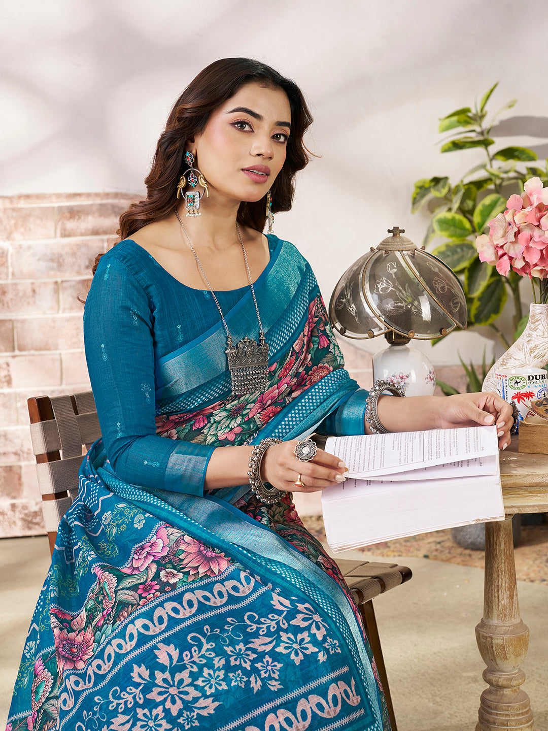 Stylish Teal Blue Printed Saree with Border Detail